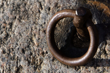 an old rusty Metal iron ring in rock