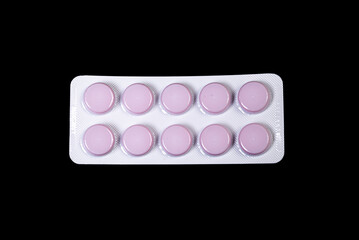 Сapsule pills in blister on a black background