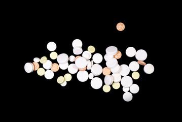 Medical pills on isolated on black background