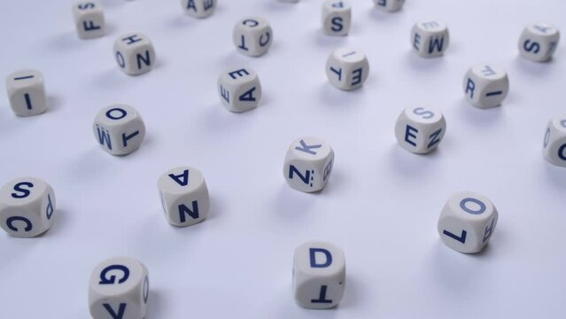 cubes or blocks word with letters randomly on a white background - the concept of a, school education or self education 