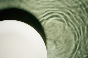 White circle copy space in transparent green blue water drop splashing gel surface flecks, waves, shade. Health care