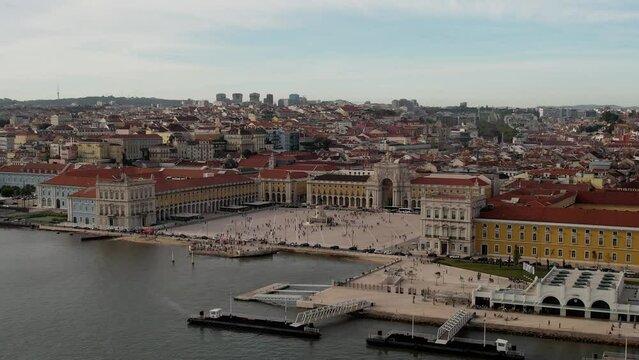 Aerial view of pedestrians at Praca do Comercio in Lisbon, Portugal with Rua Augusta in the far background