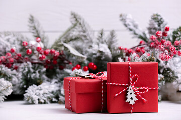 Beautiful gift boxes and Christmas decor on white table. Space for text