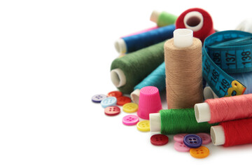 Sewing threads of different colors on reels isolated on a white background.