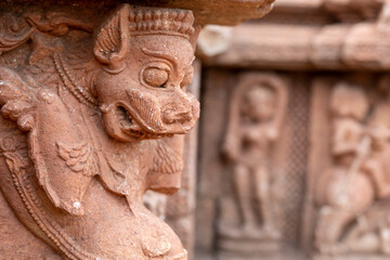 Fototapeta na wymiar Ancient Lion Statue or Mythical Lion sculpture on the walls of the ancient 13th century A.D. Suka Sari temples, Old Town, Bhubaneswar, Odisha, India.