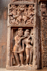 Fototapeta na wymiar Ancient sandstone carvings on the walls of the ancient Indian temple.13th century A.D. Suka Sari temple Odisha, India.