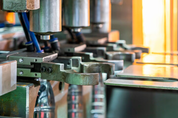 Close up pneumatic gripper for hold preform plastic pet bottle making on bottle blowing machine for manufacturing process in industrial