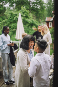 Happy grandmother looking at grandchild at party