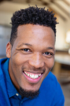 Portrait of happy african american man looking at camera and smiling