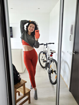 Beautiful Young Woman Take Selfie In Mirror Before Went To Bicycle Ride