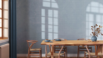 Farmhouse dining room with wooden table and chairs in blue and beige tones. Plaster walls, boho interior design