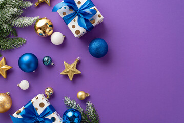 New Year celebration concept. Top view photo of trendy gift boxes with ribbon bows blue white and gold baubles star ornaments and pine branches in snow on isolated violet background with empty space