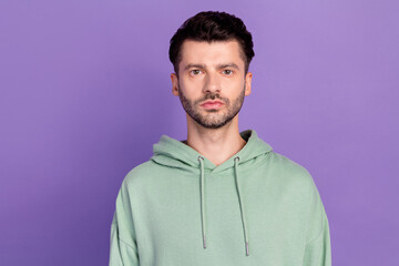 Closeup photo of young funny serious businessman bearded bristle wear khaki hoodie stylish programmer look you isolated on violet color background