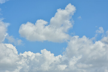 White clouds against blue sky for a backgrounds.