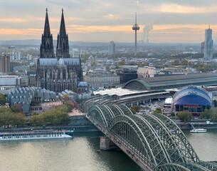 The city of Köln from observation tower focusing on the Köln Dom, tower, railway bridge and station.
