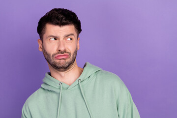 Closeup photo of youngster funny student man bristle brunet pouted lips look empty space unsatisfied dont like information isolated on violet color background