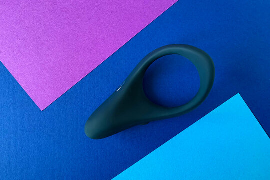 Cock ring on blue background. Vibrating cock ring for penis