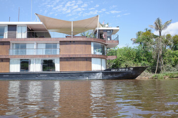 Iquitos, Peru - 27 June 2022: A cruise boat on the Amazon river near the port of Iquitos, Peru