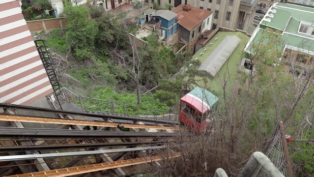 Static view of the rail and cabin of El Peral elevator, tourist and heritage transporter, Cerro Alegre, Chile.