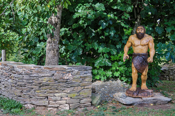 Sculpture of an ancient man in wood. Fillobal, Lugo, Galicia, Spain. French Way of Saint James.