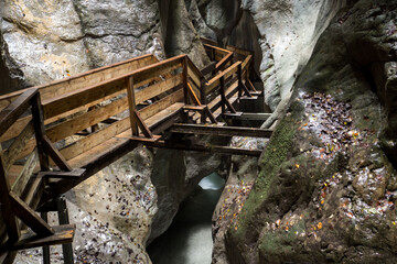 wooden path through a narrow gap between two rocks