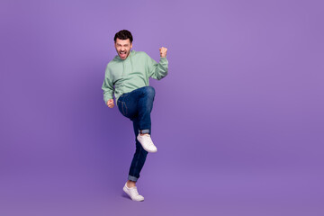 Fototapeta na wymiar Full body size photo of young successful businessman wear stylish outfit fists up enjoy crazy empty space new tournament isolated on violet color background
