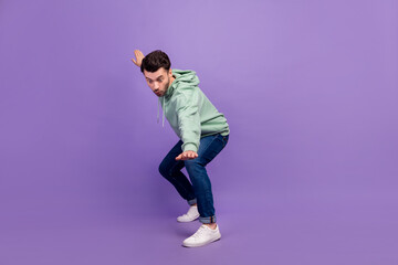 Fototapeta na wymiar Full body length photo of young excited surprised man wear nice outfit take shot posing look down dangerous isolated on violet color background