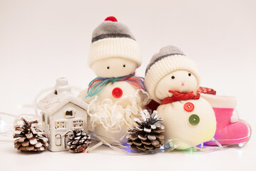 Celebrate christmas and happy new year on white.Handmade snowmans.