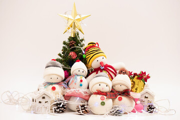 Celebrate christmas and happy new year on white.Handmade snowmans.