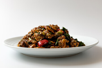 Blood cockle with spices on a white background