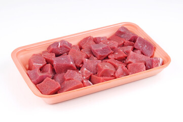 Raw Beef cubes in plate package isolated
