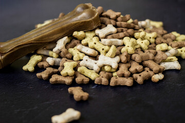 Chewing bones on black wooden background
