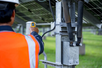 Technicians are checking the operation of the solar power plant equipment so that the power generation can operate at full capacity. Alternative energy to conserve the world's energy