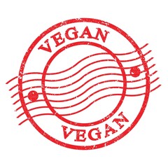 VEGAN, text written on red  postal stamp.