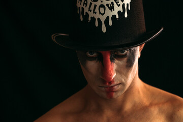 portrait of a man in a hat. Halloween man. Halloween concept photo. Evil. Horror