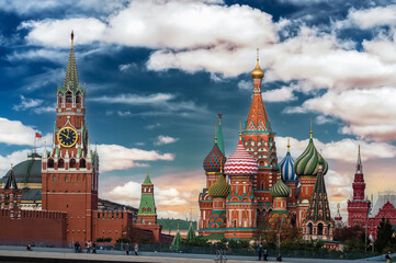 Landmarks of Moscow: Kremlin, St. Basil's Cathedral, Spasskaya Tower. Colorful cathedral in Red square, Russia - obrazy, fototapety, plakaty