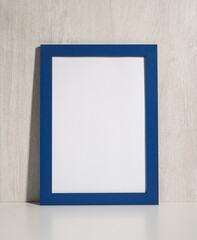 Vertical photo frame mockup on beige wall. blank diploma frame on white wall background. Picture...