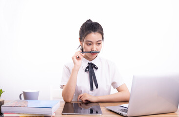 Asian female students taking an online class against a white background