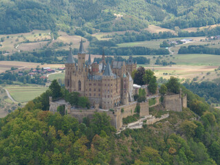 Fototapeta na wymiar Burg Hohenzollern castle between Hechingen and Bisingen Germany, was the medieval castle of the Hohenzollern family. Stronghold fortress culturale heritage.