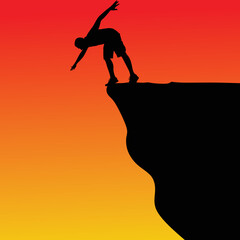 Silhouette of standing man on cliff
