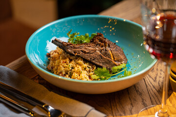 lamb ribs and porridge couscous in a restaurant