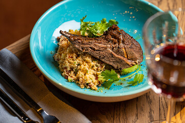 lamb ribs and porridge couscous in a restaurant