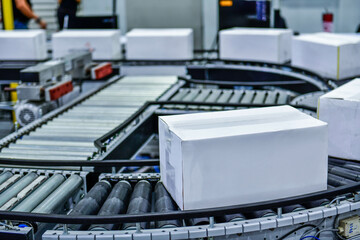 White paper box on conveyor belt. parcels transportation system concept	
