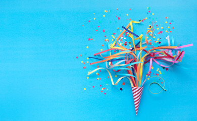 Celebration,party backgrounds concepts ideas with colorful confetti,streamers on blue