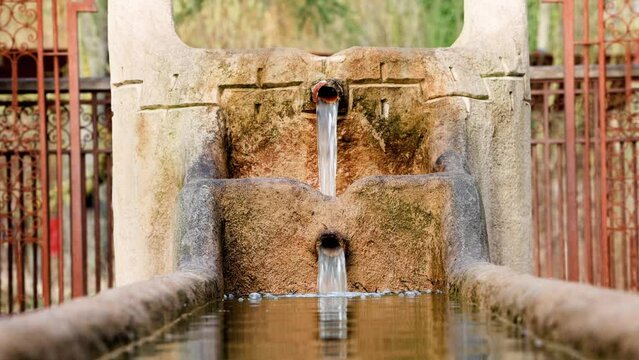 Beautiful ancient style fountain, water tap with water reservoir, Morocco. High quality FullHD footage