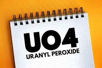 UO4 - uranyl peroxide acronym text on notepad, abbreviation concept background