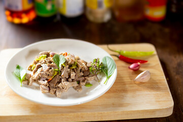 Breakfast with boiled pork mixed with Thai herbs is sour, salty, spicy.