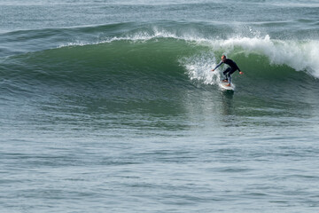 Local surfer riding waves