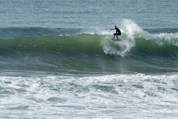 Local surfer riding waves