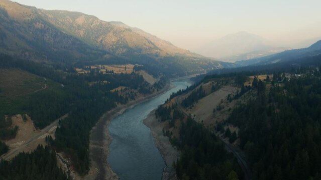 The Fraser River at sunrise in BC. A huge flowing river system in Western Canada supporting wild Salmon, near Lytton British Columbia.
